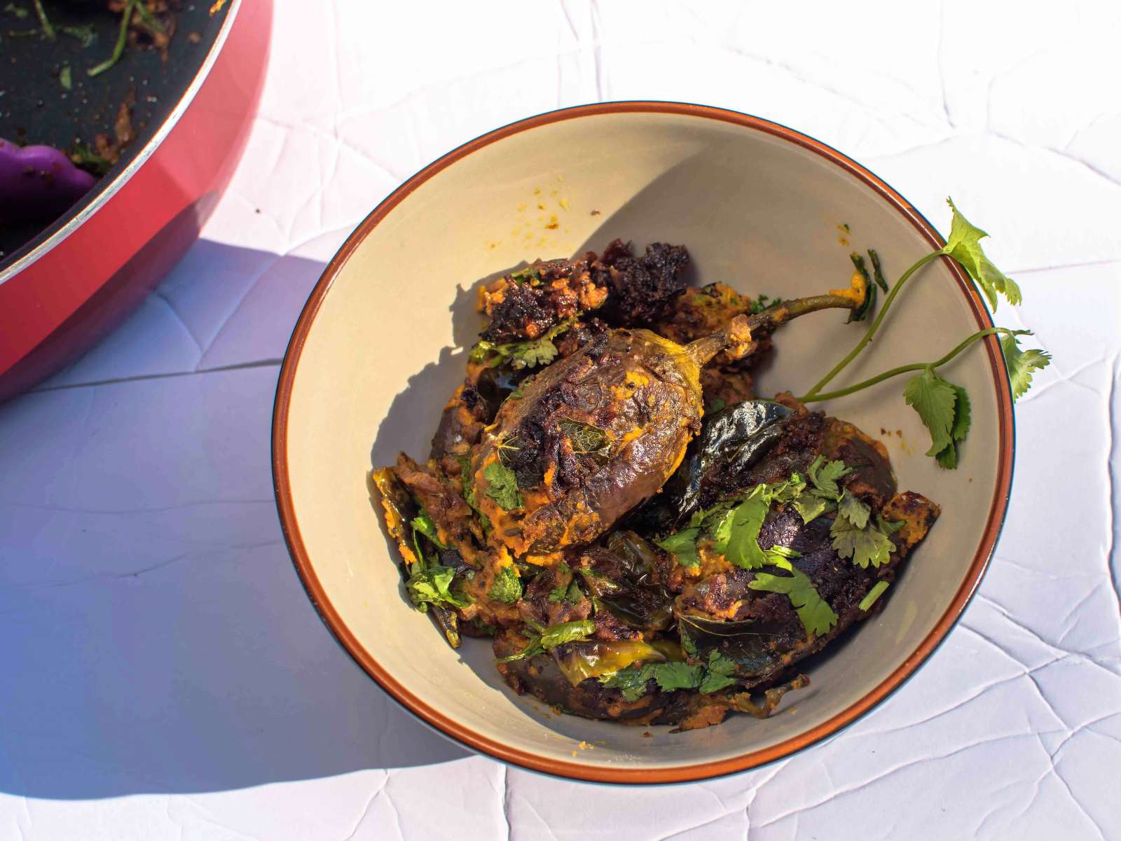 Stuffed brinjals simmering in a rich, spiced gravy 